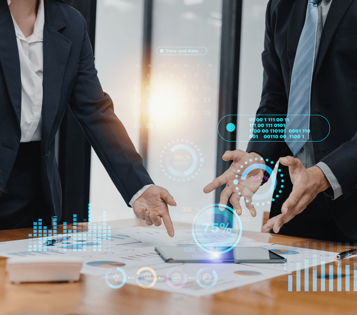Business meeting with digital data graphics displayed.